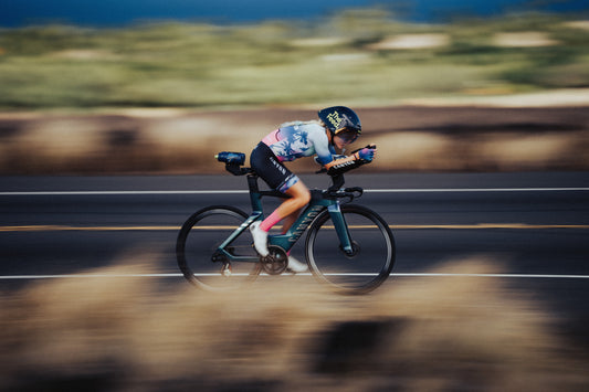 Rider on a road on a triathlon bike in the aero position